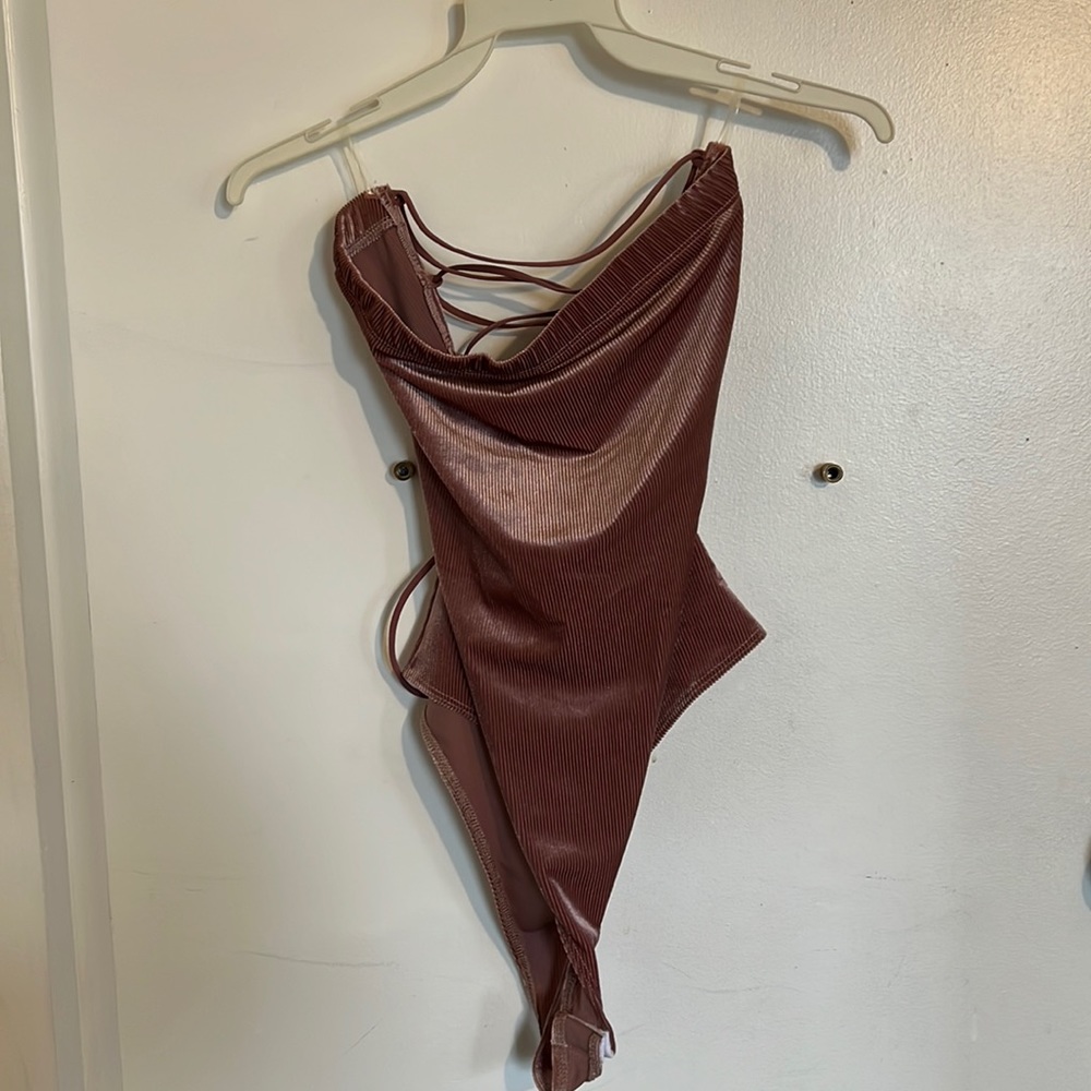 Mauve bodysuit. Never worn. Size large.